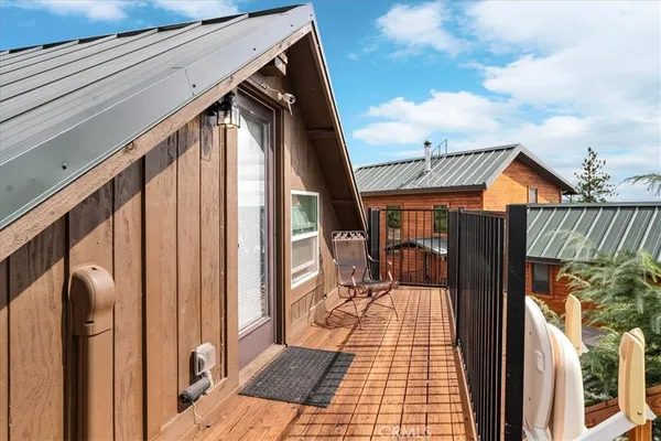 a view of a backyard with table and chairs and potted plants
