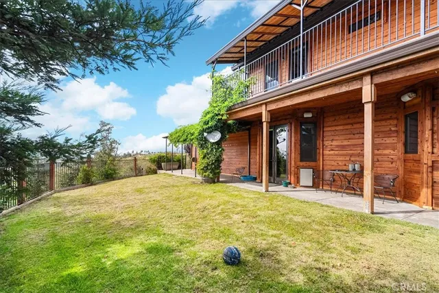 a view of a livingroom with furniture window and wooden floor