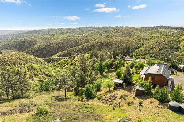 a room with chandelier furniture and a large window