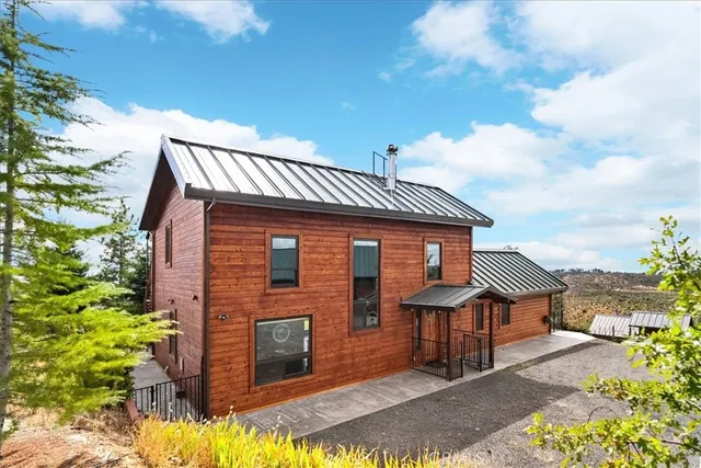 a room with chandelier furniture and a large window