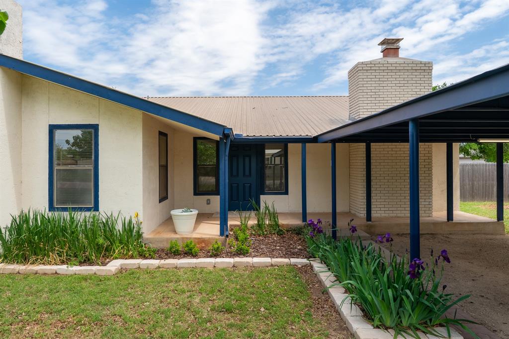 809 Turner Lane Tuscola, TX 79562 - Photo 1 of 25 Entrance to property featuring a chimney, stucco siding, and a metal roof