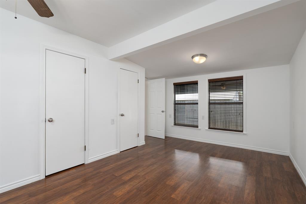 809 Turner Lane Tuscola, TX 79562 - Photo 12 of 25 Unfurnished bedroom with dark wood-style floors and ceiling fan