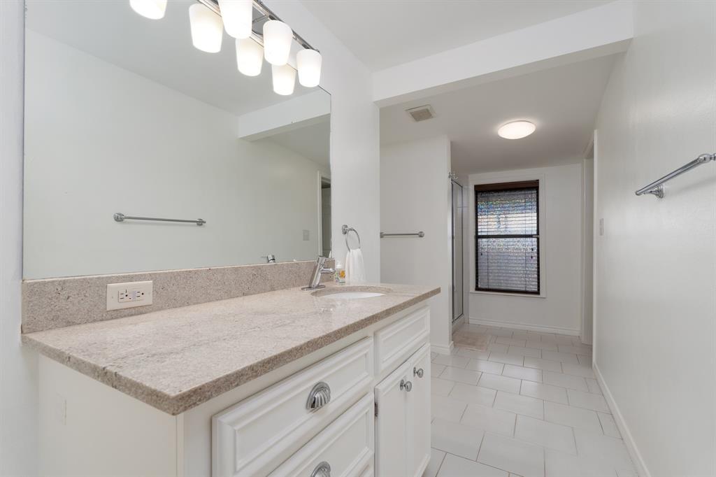 809 Turner Lane Tuscola, TX 79562 - Photo 15 of 25 Bathroom featuring vanity and tile patterned floors