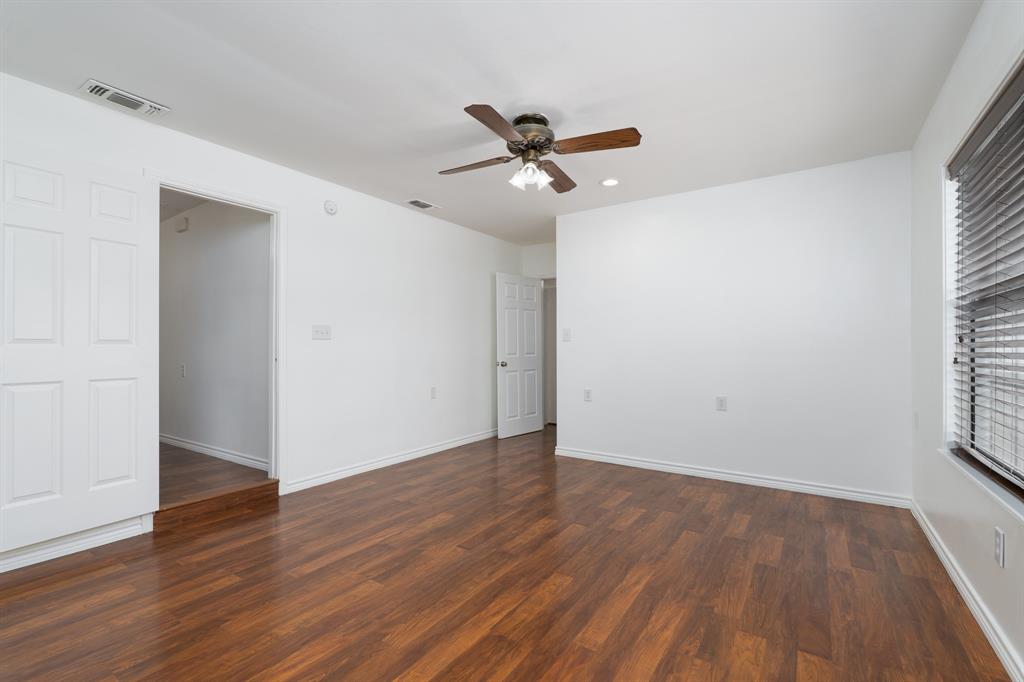 809 Turner Lane Tuscola, TX 79562 - Photo 4 of 25 Spare room featuring wood finished floors, a ceiling fan, and recessed lighting