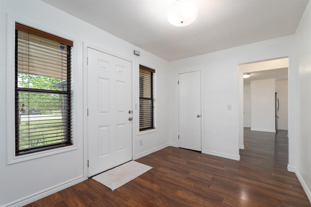 809 Turner Lane Tuscola, TX 79562 - Photo 9 of 25 Foyer entrance featuring dark wood-type flooring and baseboards