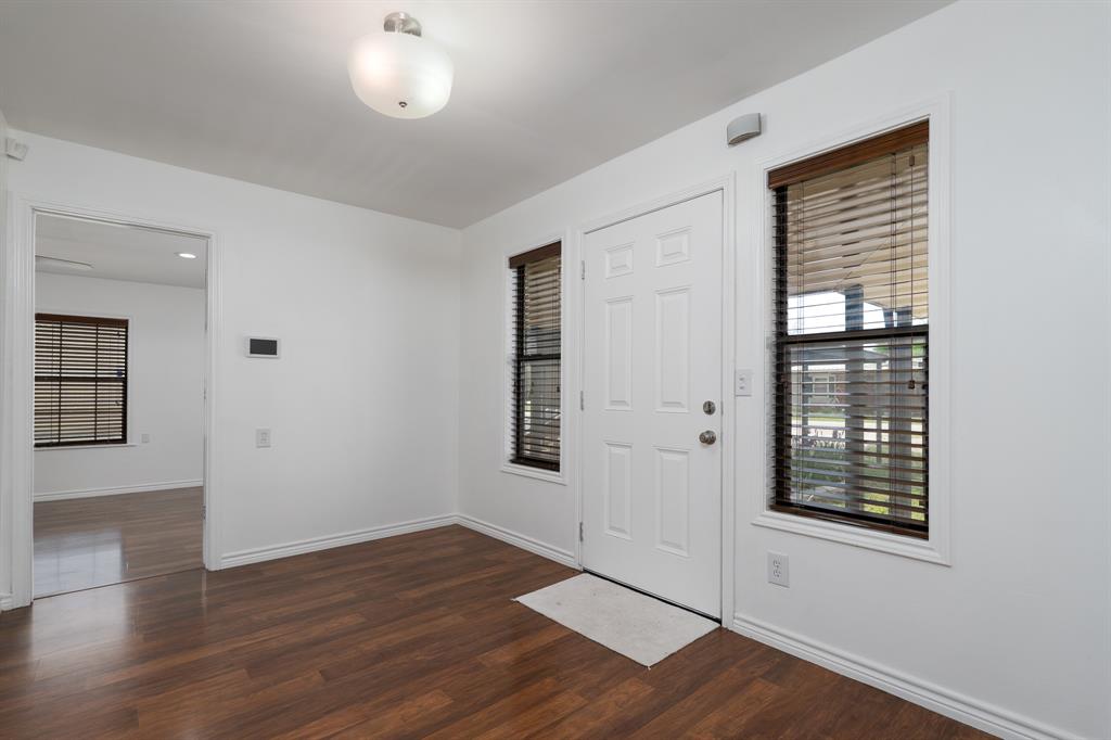 809 Turner Lane Tuscola, TX 79562 - Photo 10 of 25 Foyer featuring dark wood-type flooring and baseboards