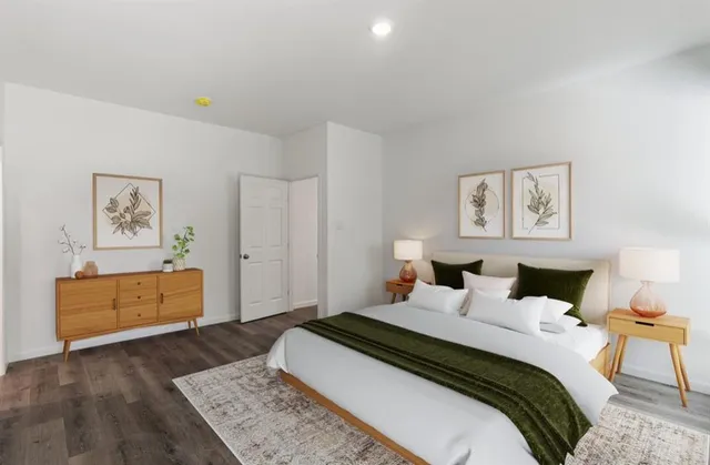 a bedroom with a bed and a dresser