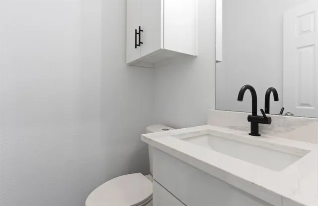 a bathroom with a sink and toilet
