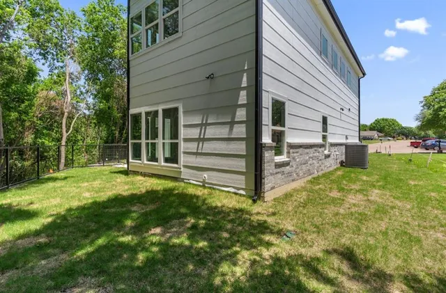 a view of backyard with a garden and deck