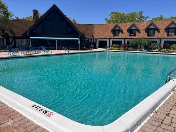 a view of a house next to a big yard
