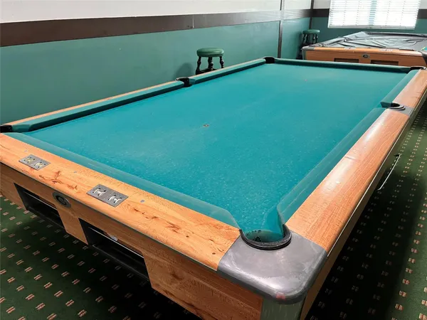 a view of a street with red and white house