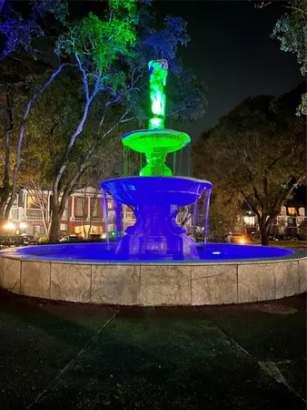 a view of a lake with table and chairs