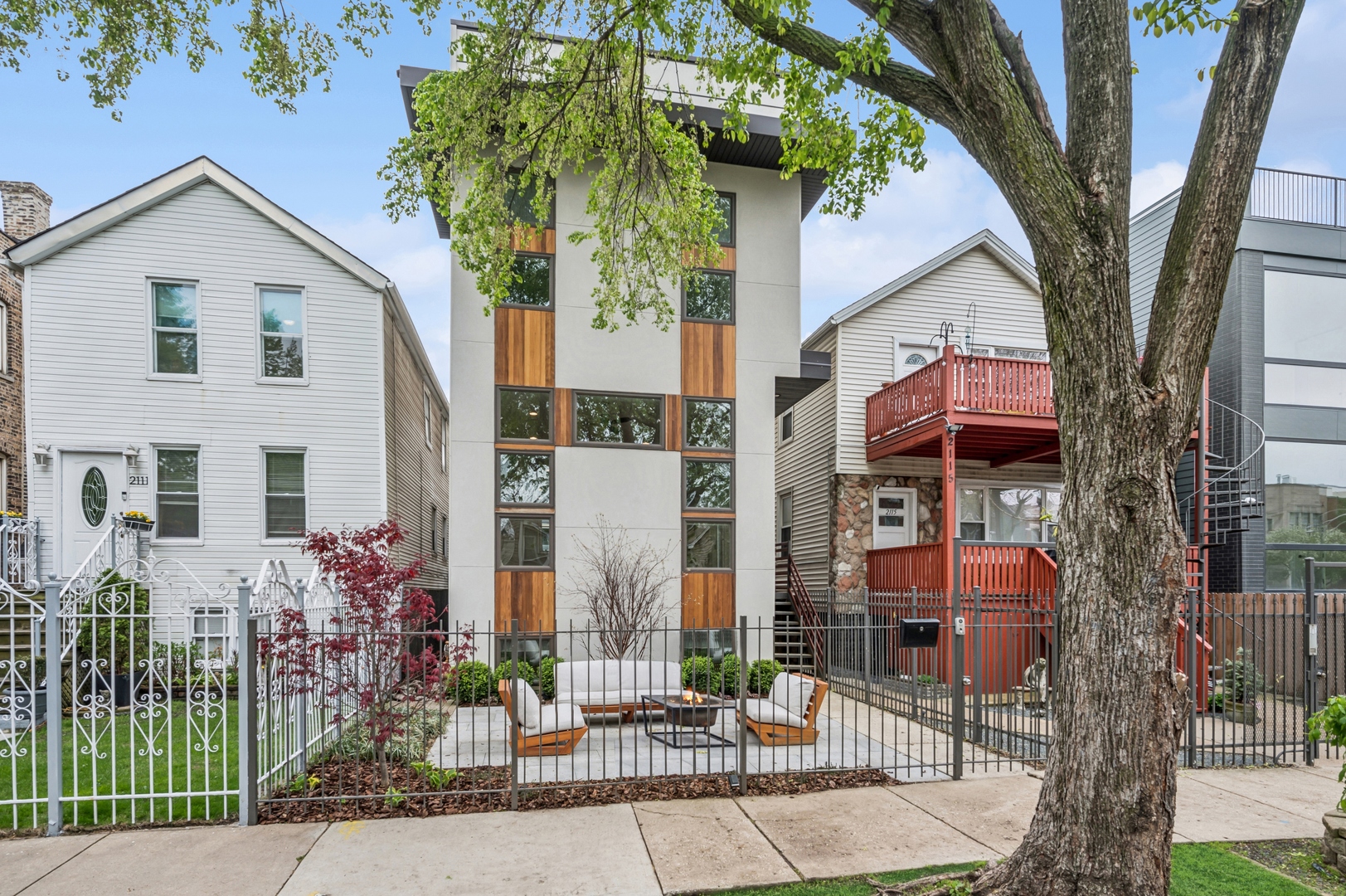 2113 West Huron Street Chicago, IL 60612 - Photo 2 of 49 a front view of a house with a tree