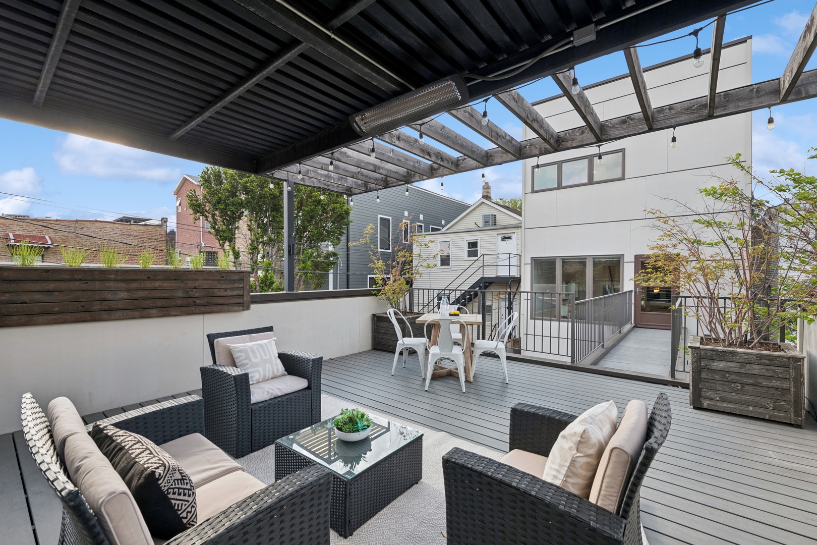 2113 West Huron Street Chicago, IL 60612 - Photo 22 of 49 a outdoor living space with furniture and a fireplace