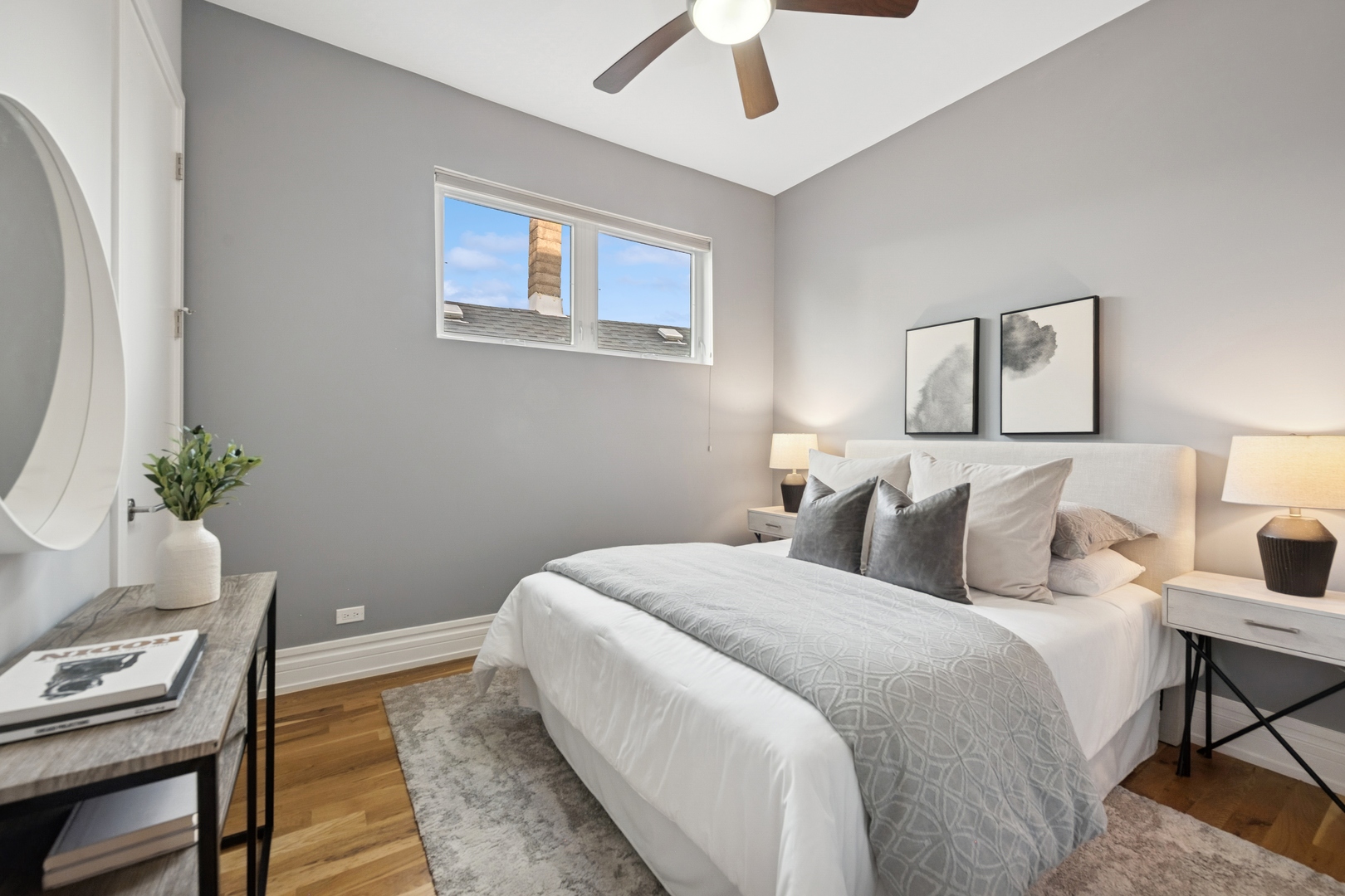 2113 West Huron Street Chicago, IL 60612 - Photo 31 of 49 a bedroom with a bed and a lamp on the dresser