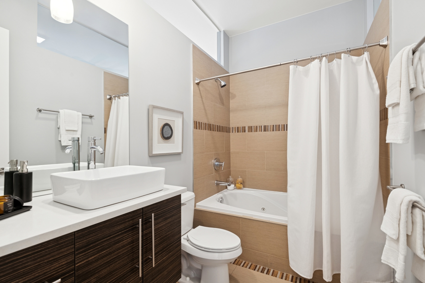 2113 West Huron Street Chicago, IL 60612 - Photo 34 of 49 a bathroom with a sink a toilet a mirror and shower