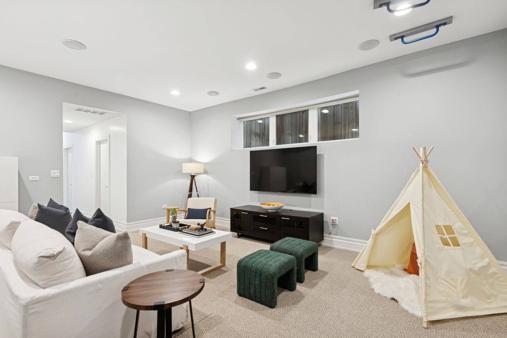 2113 West Huron Street Chicago, IL 60612 - Photo 36 of 49 a living room with furniture and a flat screen tv