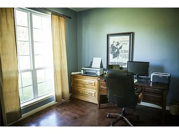 a workspace with furniture and a window