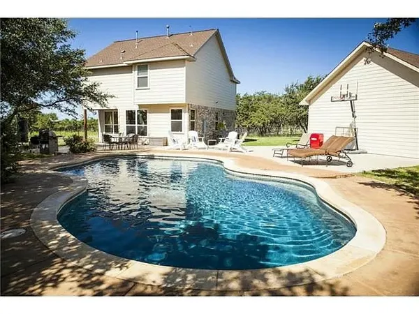 a view of a house with swimming pool