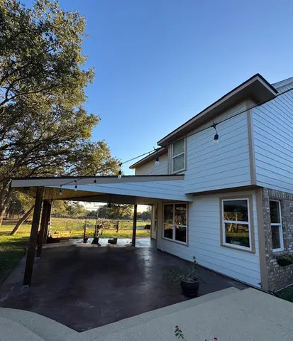 a view of swimming pool with an outdoor seating