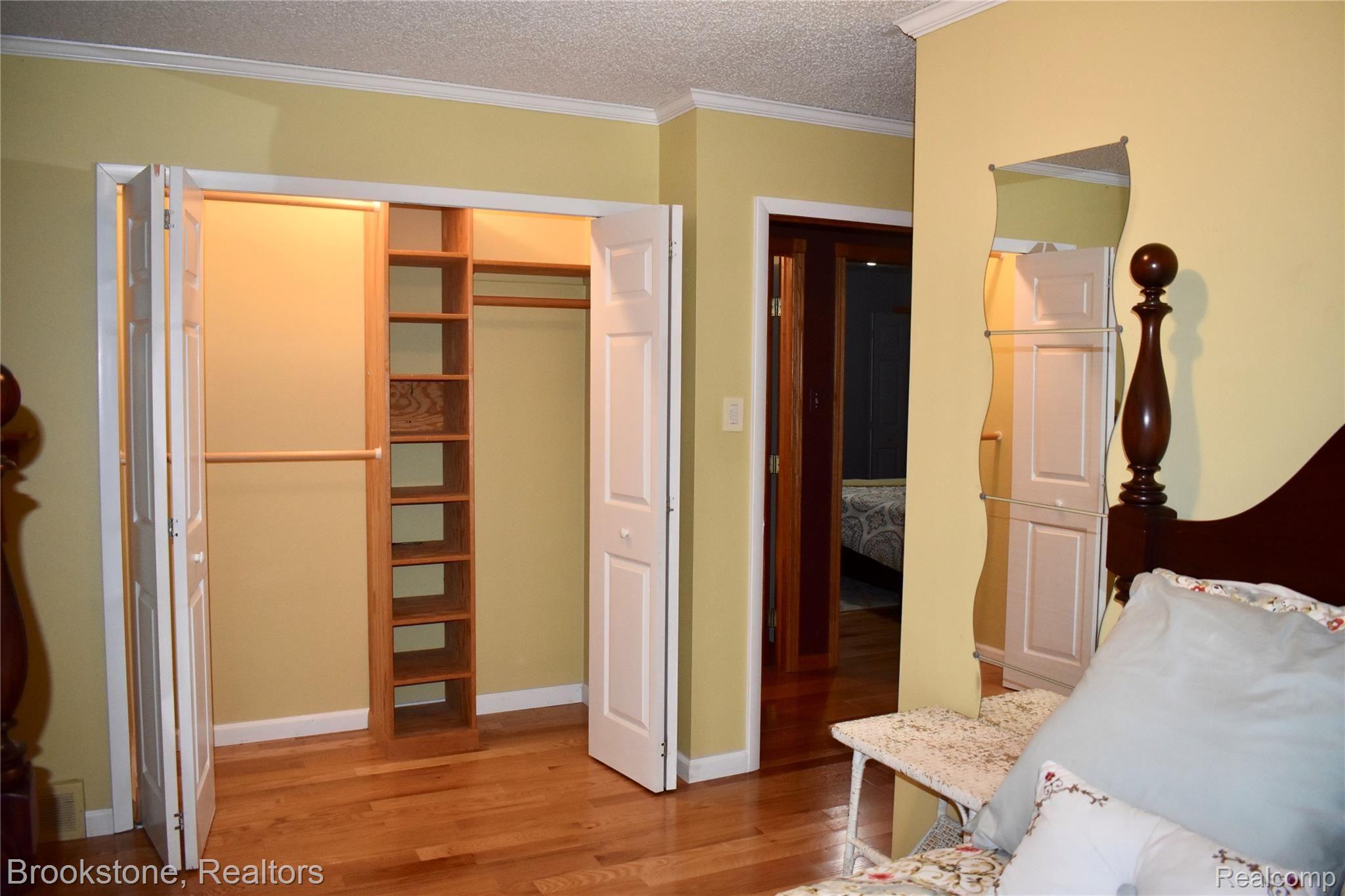 405 Baldwin Ridge Oxford, MI 48371 - Photo 39 of 54 THIS LARGE CHILDREN'S 2ND BEDROOM (11X13) FEATURES A LARGE CLOSET & A WOOD FLOOR