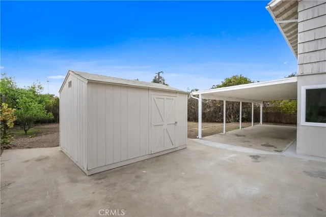 a view of a house with a backyard and balcony