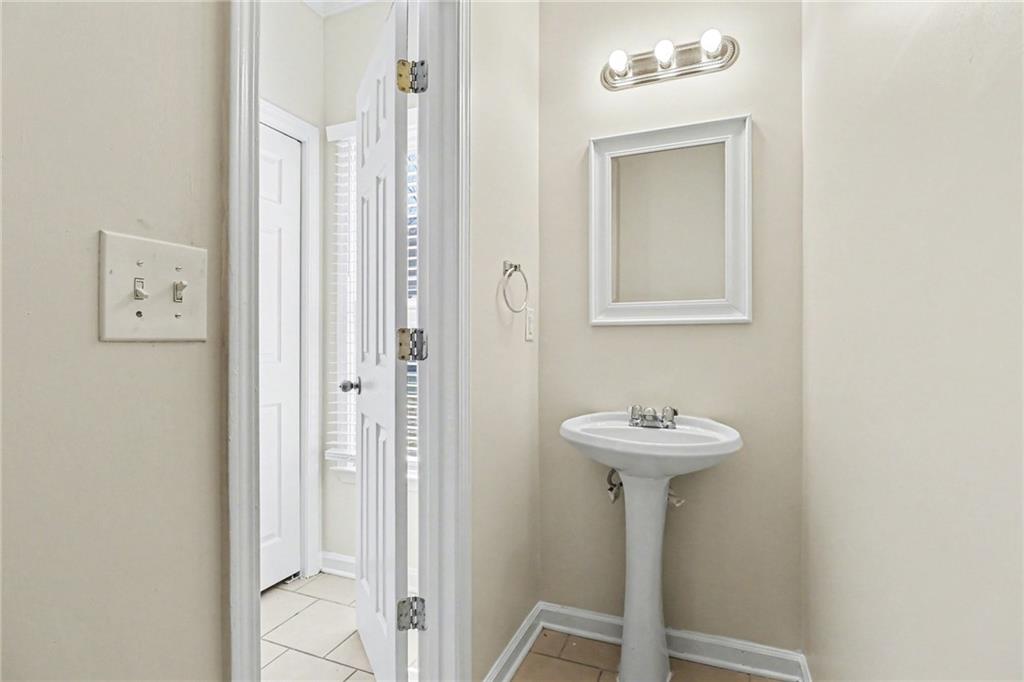 7170 Threadstone Overlook Duluth, GA 30097 - Photo 13 of 26 a bathroom with a sink and a mirror