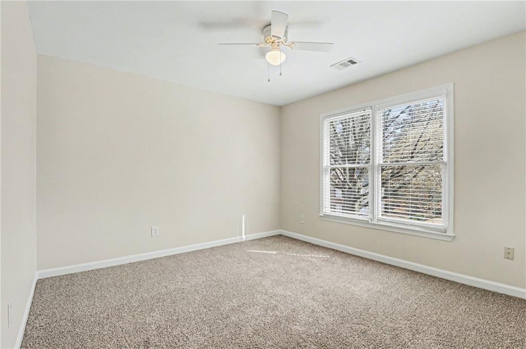 7170 Threadstone Overlook Duluth, GA 30097 - Photo 14 of 26 a view of an empty room with a window