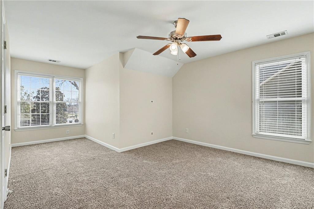 7170 Threadstone Overlook Duluth, GA 30097 - Photo 16 of 26 a view of an empty room with a window