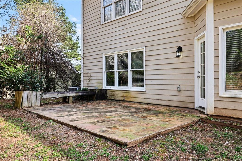 7170 Threadstone Overlook Duluth, GA 30097 - Photo 23 of 26 a view of a house with backyard and trees
