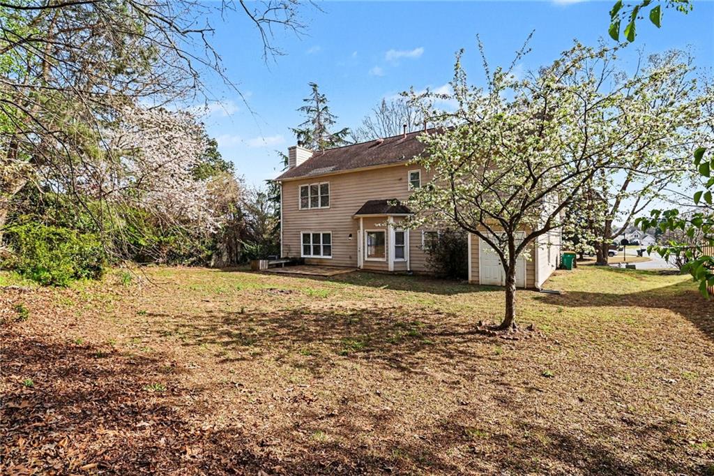 7170 Threadstone Overlook Duluth, GA 30097 - Photo 25 of 26 a house with trees in front of it