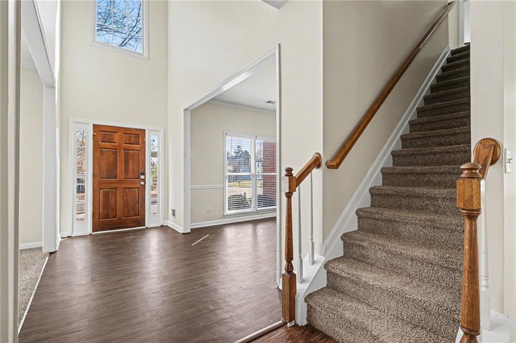 7170 Threadstone Overlook Duluth, GA 30097 - Photo 4 of 26 a view of an entryway with wooden floor
