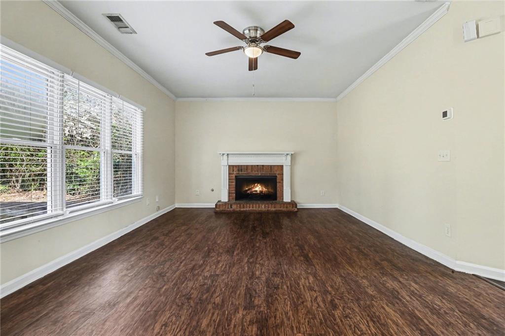 7170 Threadstone Overlook Duluth, GA 30097 - Photo 5 of 26 a view of empty room with wooden floor and fan
