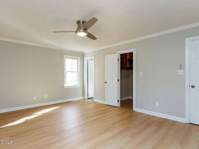a view of empty room with floor to ceiling window