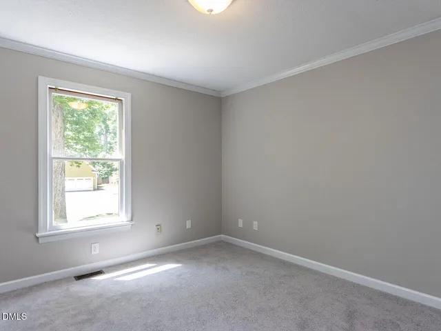 a close view of a sink and mirror with window
