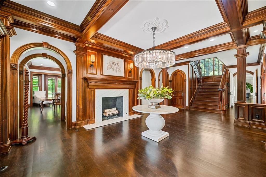 641 Hidden Meadows Lane Ligonier, PA 15658 - Photo 4 of 24 a living room with couches a fireplace and a dining table with wooden floor