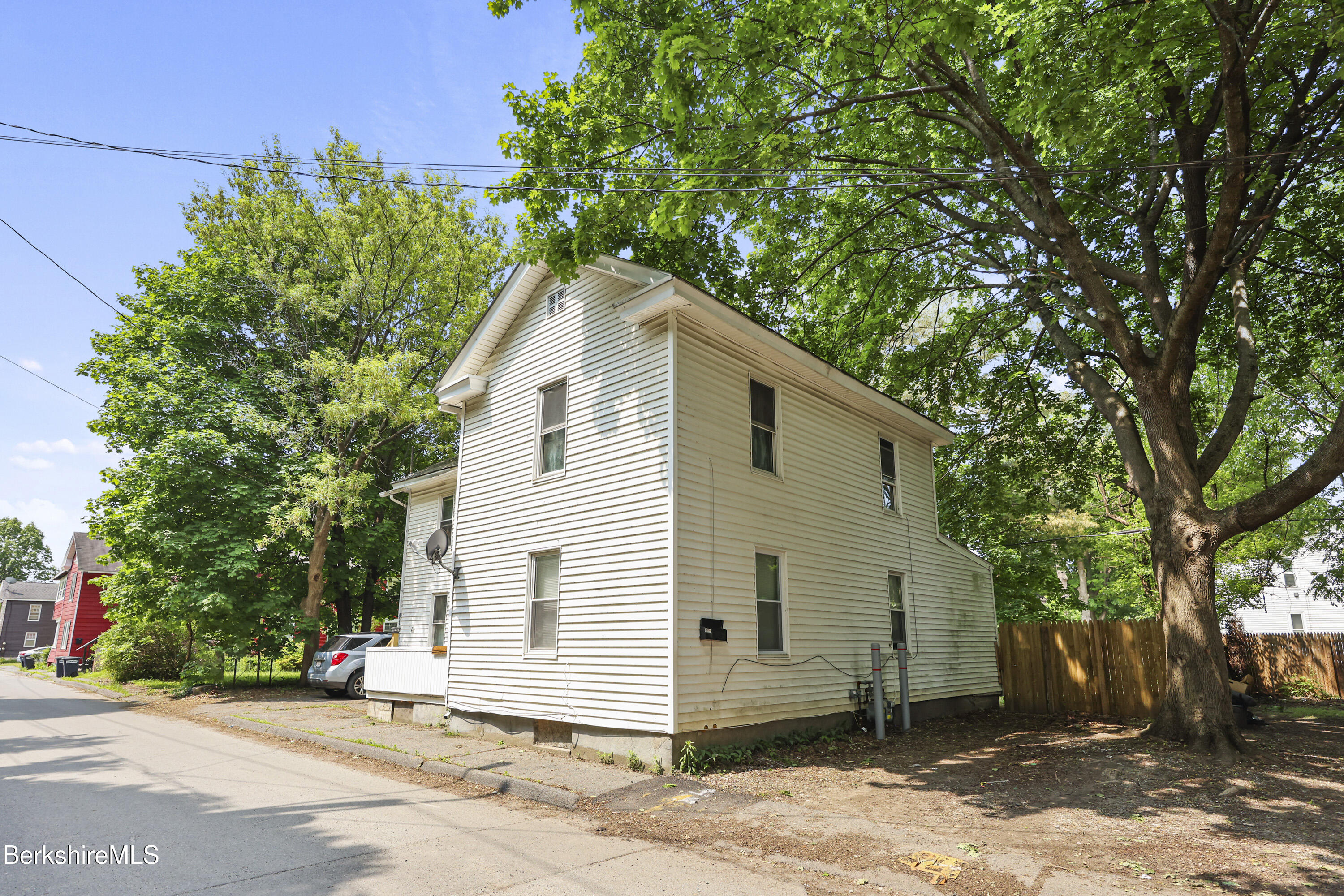 21 Pleasant Street Pittsfield, MA 01201 - Photo 2 of 16 a view of a house with a backyard