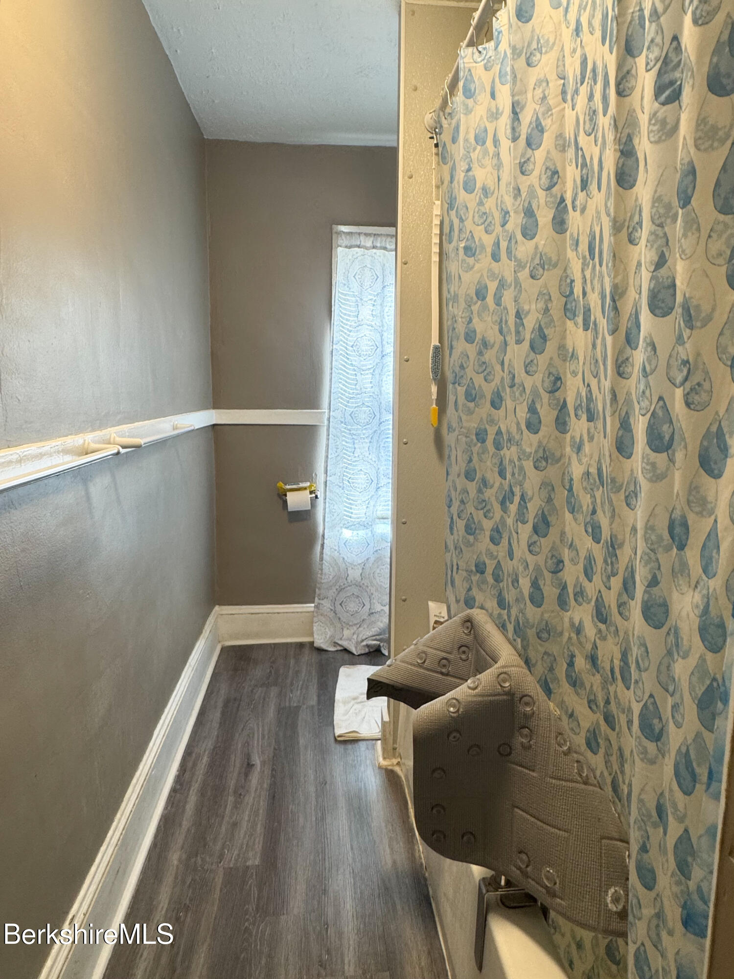 21 Pleasant Street Pittsfield, MA 01201 - Photo 5 of 16 a view of an empty room with wooden floor and a window