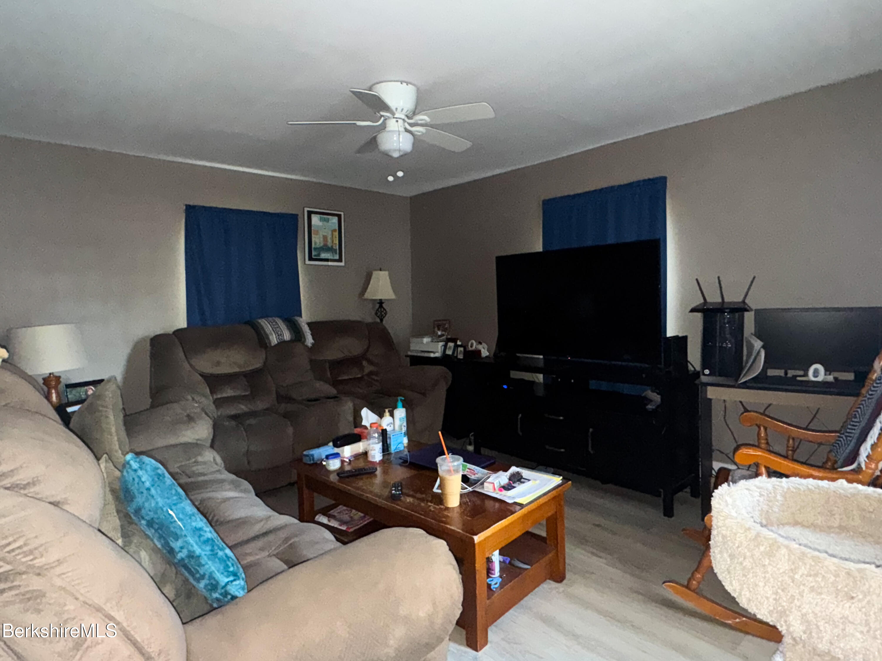 21 Pleasant Street Pittsfield, MA 01201 - Photo 8 of 16 a living room with furniture and a flat screen tv