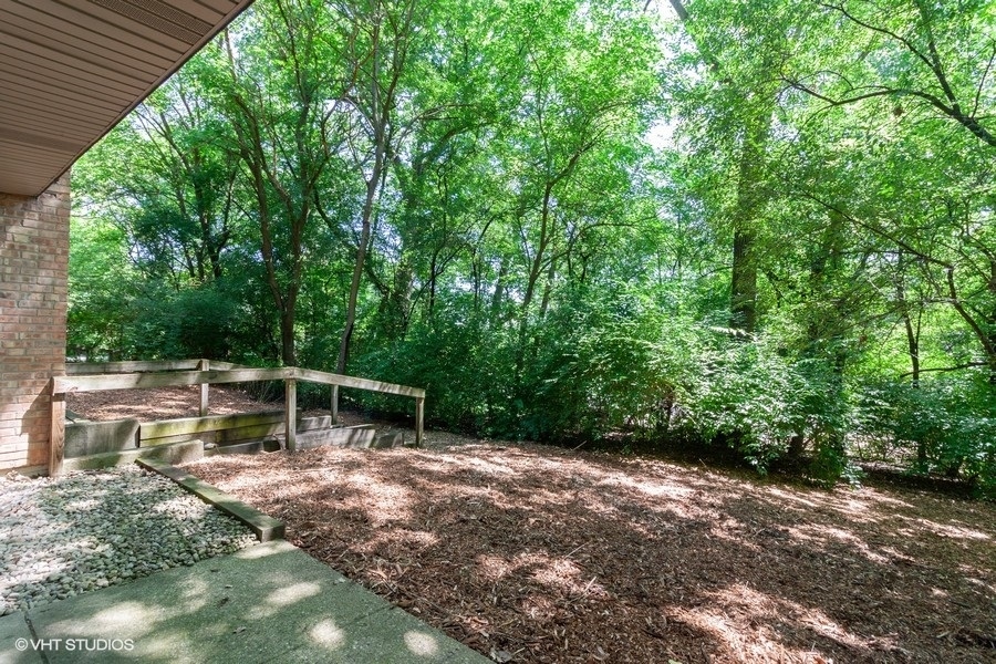 6008 Forest View Road, Unit 1D Lisle, IL 60532 - Photo 12 of 22 a backyard of a house with lots of green space