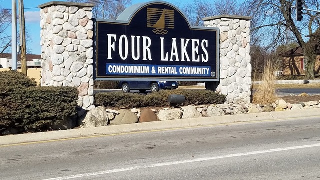 6008 Forest View Road, Unit 1D Lisle, IL 60532 - Photo 13 of 22 a view of a brick building with a street sign