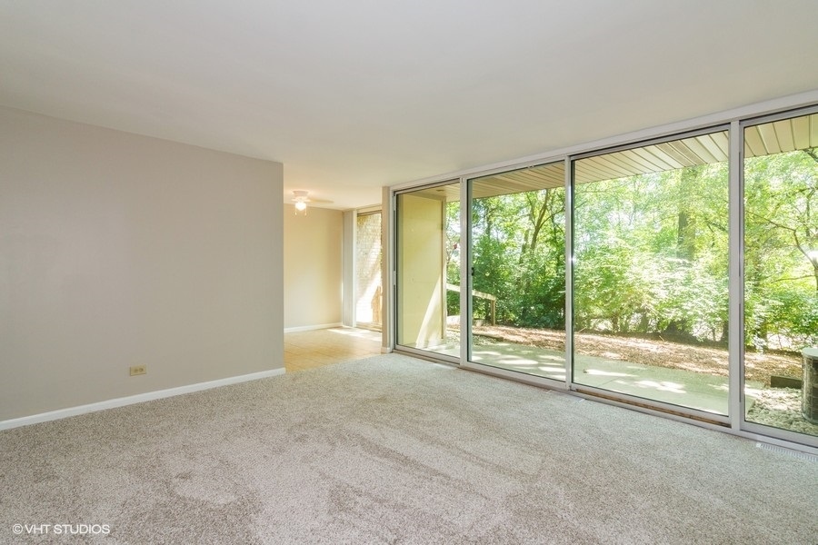 6008 Forest View Road, Unit 1D Lisle, IL 60532 - Photo 3 of 22 a view of empty room with window