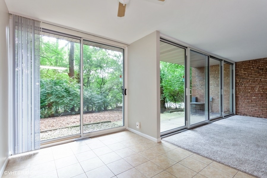 6008 Forest View Road, Unit 1D Lisle, IL 60532 - Photo 4 of 22 a view of an empty room with windows and view of balcony