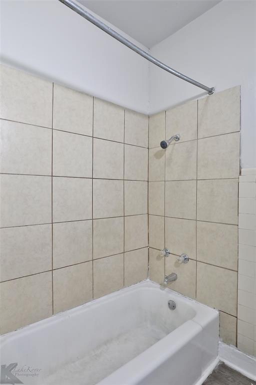 858 Beech Street Abilene, TX 79601 - Photo 11 of 24 a bathroom with a bathtub