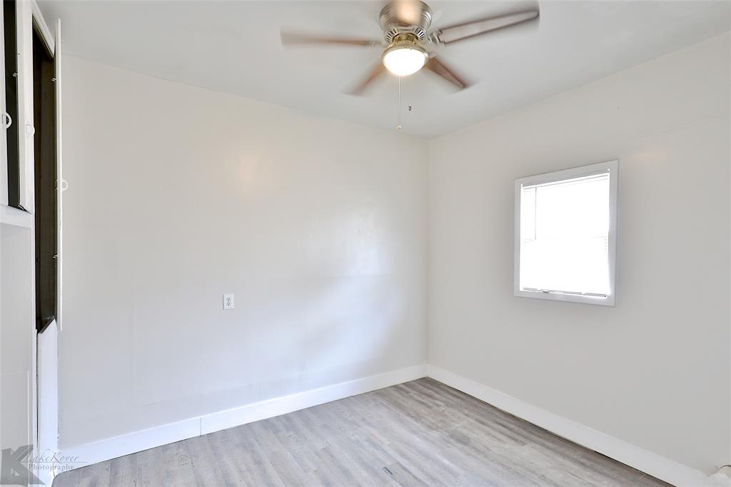 858 Beech Street Abilene, TX 79601 - Photo 17 of 24 an empty room with a window and a fan
