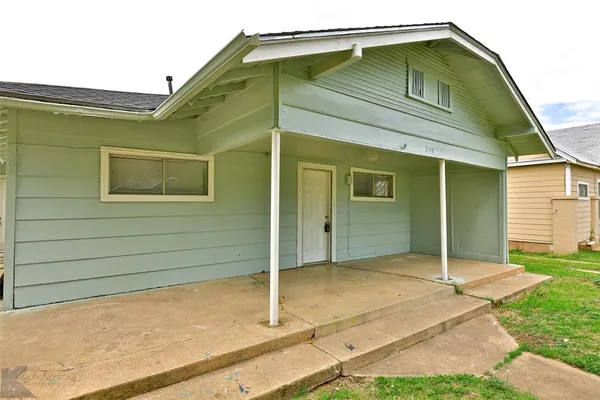 a house with trees in front of it