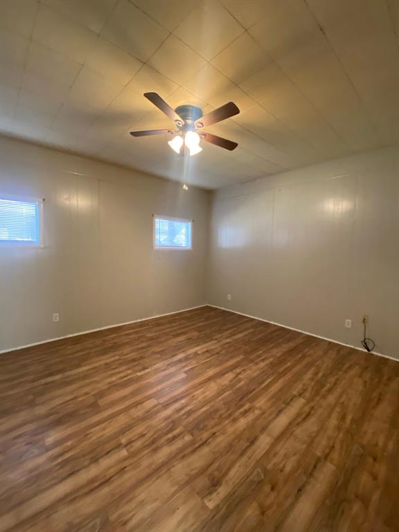 858 Beech Street Abilene, TX 79601 - Photo 22 of 24 an empty room with a empty space and a ceiling fan
