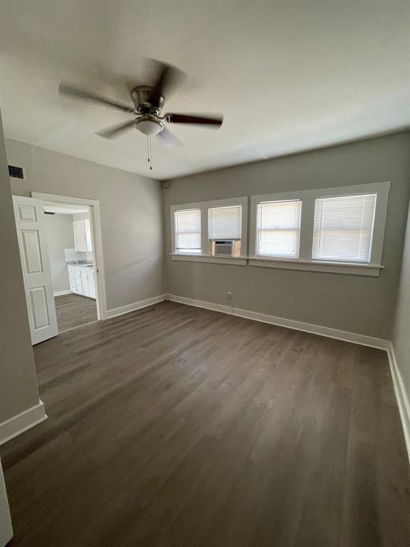 858 Beech Street Abilene, TX 79601 - Photo 24 of 24 an empty room with wooden floor fan and windows
