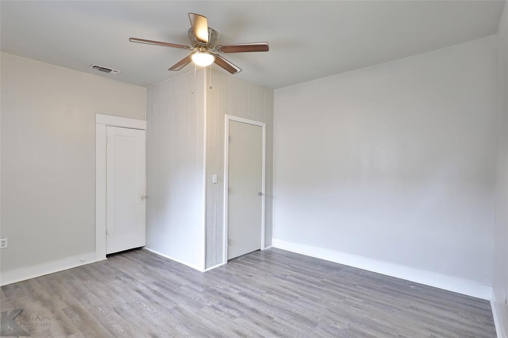 858 Beech Street Abilene, TX 79601 - Photo 6 of 24 a view of an empty room with wooden floor