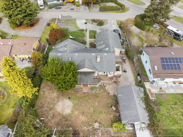 an aerial view of a house with a swimming pool
